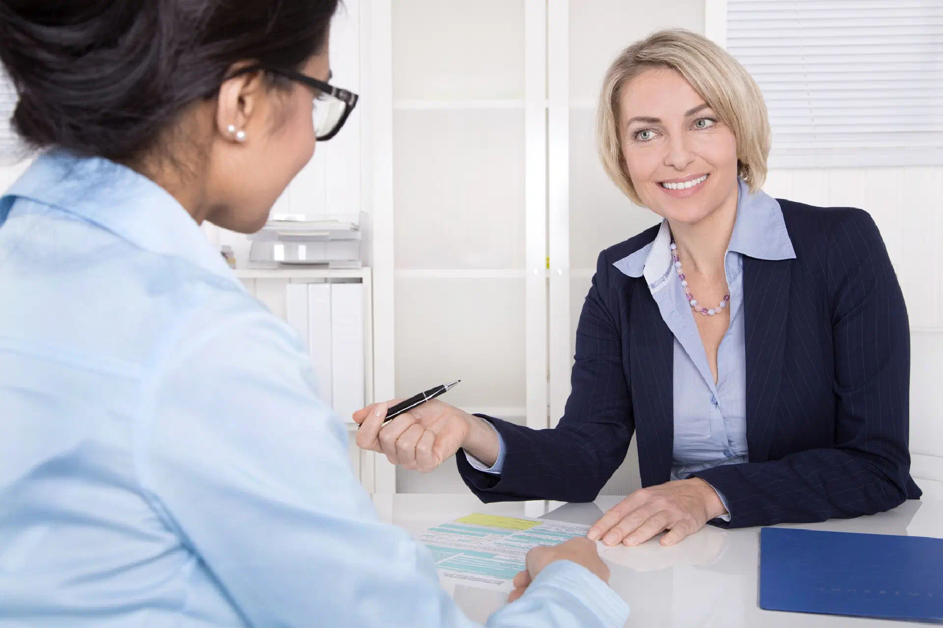 Two women talking business