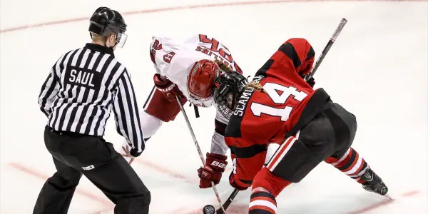 Two Ice Hockey Players And A Referee