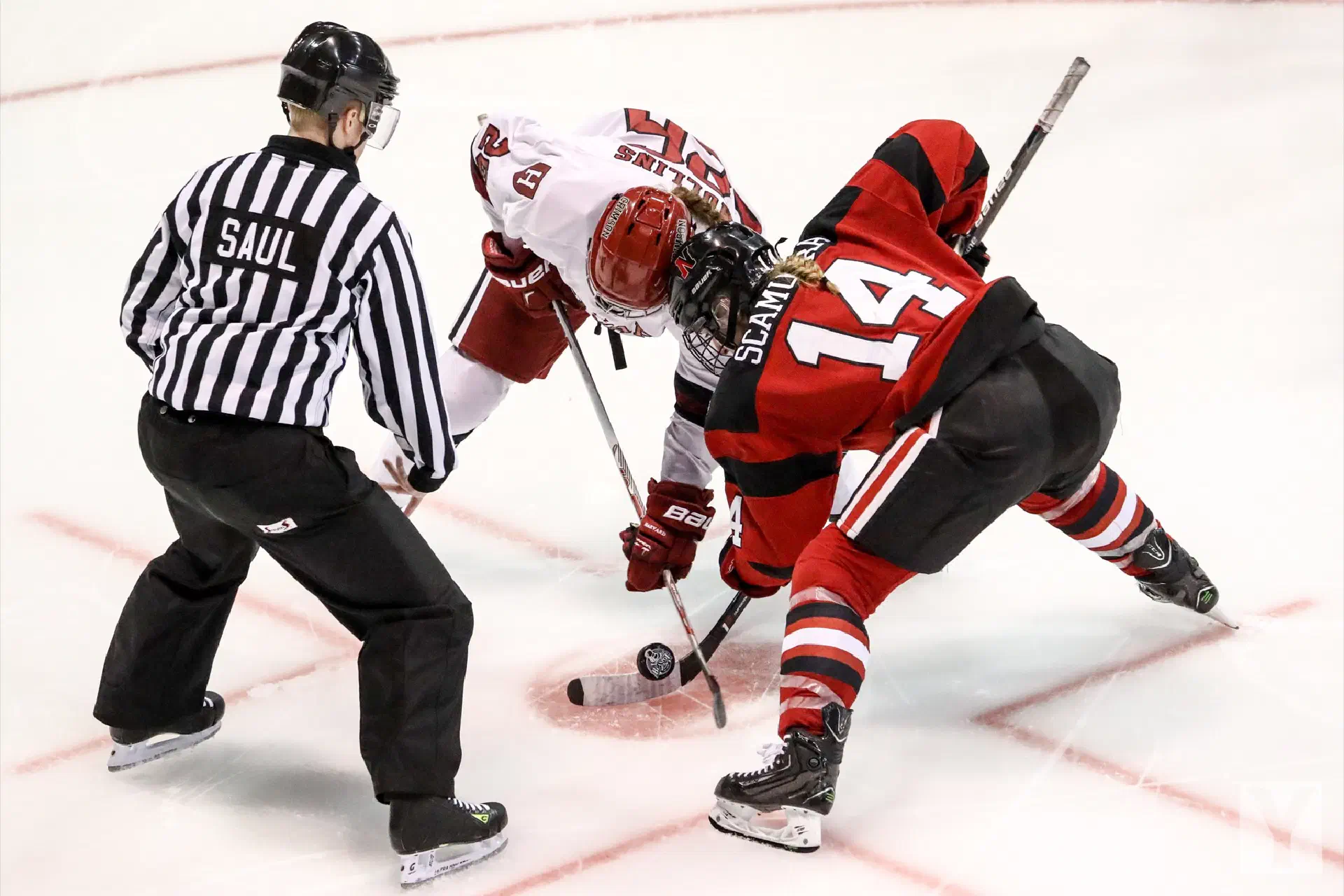 Two Ice Hockey Players And A Referee
