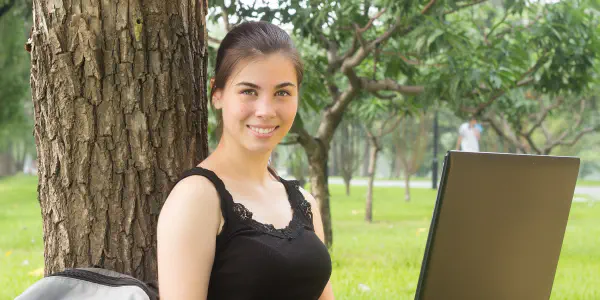 A Girl in The Park with Laptop